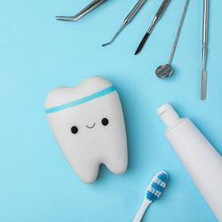 flat lay of tooth and dental care tools