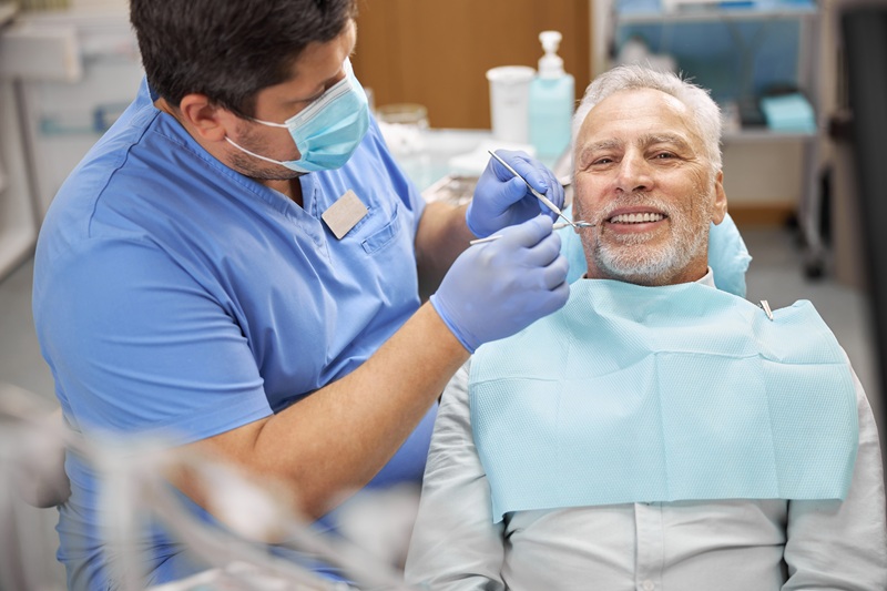 Senior patient having a dental treatment at the clinic