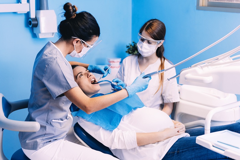 Dentists with a patient during a dental intervention. Dentist Concept